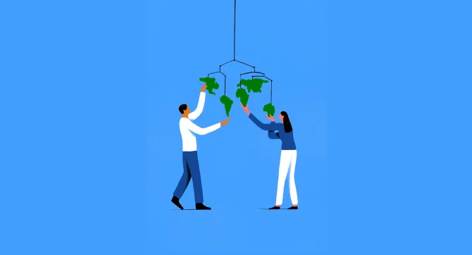 een man en een vrouw met een mobile waaraan de continenten hangen